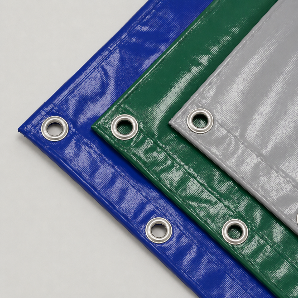 Sichtschutz-/Bauzaunplane nach Maß | PVC 600g, mit Eisen-Ösen, blau, grün und grau
